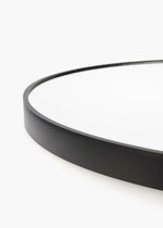 Close-up of Satin Horizon Arch Mirror matte black aluminum frame with smooth jointless design