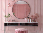 Noir Round Mirror with sleek black aluminum frame above black vanity in pink room