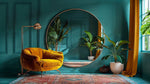 Eclipse round mirror with rose gold frame hanging in teal living room with mustard yellow velvet chair, potted plants and large window.