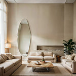 Aurora irregular curve mirror displayed in a modern living room interior with sofa and coffee table.