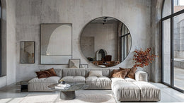 Noir Round Mirror with sleek black aluminum frame in modern living room setting