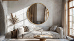 Solaro Round Mirror with brushed gold aluminum frame in modern living room setting