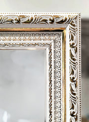 Ivory Majesty Mirror featuring an ornate white frame, elegant wall decor enhancing classic interior aesthetics